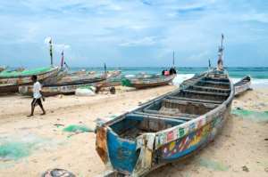 Old canoes such as these are used by migrants from Senegal for the dangerous and often deadly crossing to reach European shores.  By SEYLLOU (AFP/File)