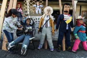 Old Year Dolls are sold on a street in Rionegro, Colombia. At New Year it is traditional practice to burn effigies of things people want to leave behind.  By Joaquin SARMIENTO (AFP)