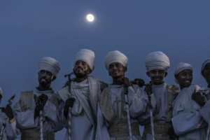 Orthodox deacons look on during the celebrations.  By Amanuel Sileshi (AFP)