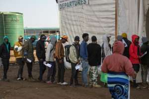 People awaiting repatriation queue to register at a centre in Musina, near the Beitbridge border crossing with Zimbabwe.  By EMMANUEL CROSET (AFP)