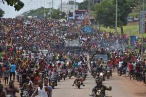 People celebrated in the streets with Guineas armed forces after the overthrow of Alpha Conde in a coup in September 2021.  By CELLOU BINANI (AFP/File)