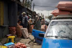 People clear out street stalls before a planned demolition in the historic Piassa neighbourhood of Addis Ababa.  By Michele Spatari (AFP)