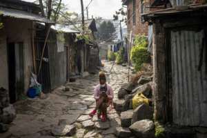 People from all walks of life rub shoulders on Piassas cobbled streets.  By Michele Spatari (AFP/File)
