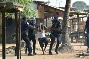 Police arrested a man in the district of Yopougon during protests there.  By SIA KAMBOU (AFP)