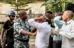 Police prevented opposition leaders from reaching the National Assembly on Sunday where votes were being counted. By GIANLUIGI GUERCIA (AFP)