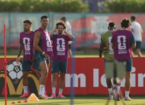 Portugals players prepare for their crucial Group K decider with Colombia.  By PATRICIA DE MELO MOREIRA (AFP)