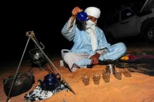 Pouring tea at a desert camp near the oasis town of Djanet.  By - (AFP)