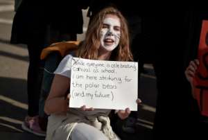 Protest: A student at a demonstration against climate change in Athens last Friday. By Louisa GOULIAMAKI (AFP)