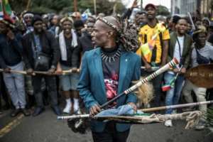 Protesters have turned out carrying sticks and shields.  By MARCO LONGARI (AFP)