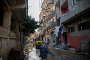 Rain floods the Nagrig street where Mohamed Salah grew up.  By Khaled DESOUKI (AFP)