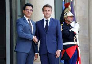 Rajoelina, seen here with French President Emmanuel Macron in Paris earlier this year, has received flak for holding French nationality.  By Ludovic MARIN (AFP)