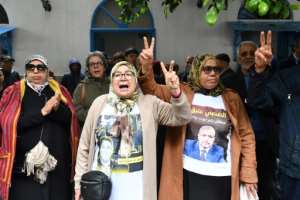Relatives of convicted opposition figures protest outside the court in Tunis on April 21.  By FETHI BELAID (AFP)