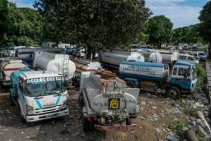 Residents either queue at water pumps or pay for private deliveries.  By Ibrahim YOUSSOUF (AFP)