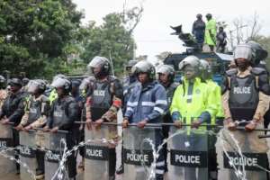 Riot police stood guard during the protest.  By Matthew Jacobs (AFP)