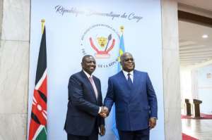 Ruto, left, and Congolese President Felix Tshisekedi on Monday.  By Arsene Mpiana (AFP)