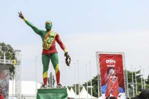 Sassou Nguesso supporters wore presidential colours for his final rally.  By Daniel BELOUMOU OLOMO (AFP)