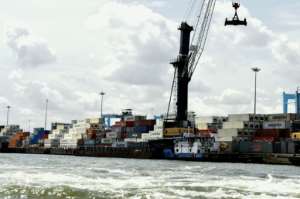 Shipping containers stacked at Lagos port. The spiralling costs of doing business at the port are handed on to the consumer.  By PIUS UTOMI EKPEI (AFP/File)