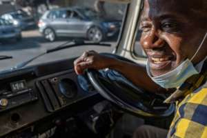 Sipho Mtshali, 63, brings a smile to selling ice-cream.  By EMMANUEL CROSET (AFP)
