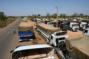 Some drivers have abandoned their trucks at the border, preferring to return home to their families.  By Sia KAMBOU (AFP)