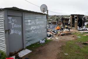 Some houses were marked as belonging to South Africans so they would be left alone.  By RODGER BOSCH (AFP)