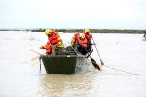 Some stranded residents were rescued by boat after roads were cut off.  By - (AFP/File)