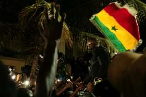 Sonko was cheered by supporters as he arrived home in Dakar following his dismissal as prime minister..  By SEYLLOU (AFP)