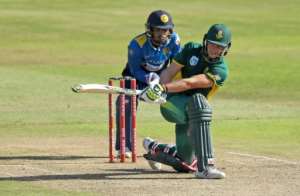 South African player David Miller plays a sweep shot as Dinesh Chandimal of Sri Lanka keeps wicket during the second One Day International cricket match between South Africa and Sri Lanka at Kingsmead cricket ground on February 1, 2017