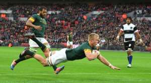 South Africas lock Pieter-Steph du Toit scores a try during their match against the Barbarians at Wembley Stadium in London on November 5, 2016