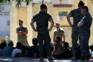 Spanish soldiers have detained some of the migrants who stayed on in Ceuta.  By Henry NICHOLLS (AFP)