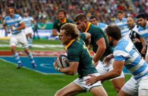 Springboks full-back Andries Coetzee (C) runs with the ball during the International Rugby Test match against Argentina August 19, 2017