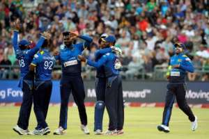 Sri Lanka players celebrate after the dismissal of AB de Villiers (not visible) during their T20 cricket match against South Africa at Newlands on January 25, 2017, in Cape Town
