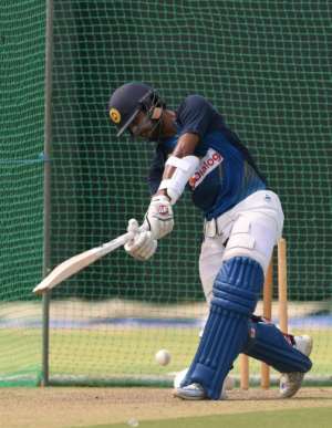 Sri Lankas Dinesh Chandimal plays a shot during a practice session at the R. Premadasa Cricket Stadium in Colombo, in September 2016
