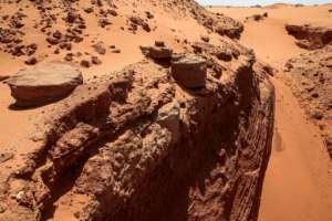 Sudanese treasure hunters use mechanical diggers to cut deep trenches at ancient sites looking for gold.  By Ebrahim HAMID (AFP Photo)