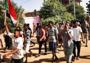 Sudanese youths protest in the streets of the capital Khartoum, amid ongoing demonstrations against a military takeover.  By - (AFP)