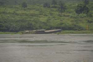 Sunken vessels remind passengers of the perils on the mighty Congo River.  By Arsene Mpiana (AFP)