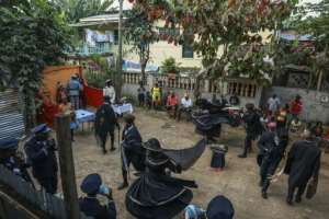The action takes place in an open-air courtyard surrounded by peoples homes.  By Daniel BELOUMOU OLOMO (AFP)