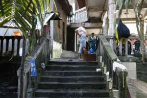 The Balde family lives in a house shared with other tenants where the poverty is striking.  By PATRICK MEINHARDT (AFP)