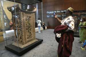 The ceremonial throne of King Ghezo, one of the artefacts looted by French colonial soldiers, was among the items returned and displayed.  By PIUS UTOMI EKPEI (AFP)