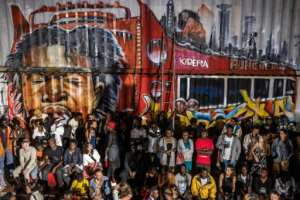 The crowd at the Kibera Fashion Week sometimes gets rambunctious.  By LUIS TATO (AFP)