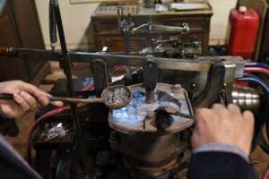 The French-made typecasting machine is over a century old.  By Ahmad HASSAN (AFP)