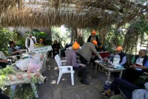 The Friends of the Tree group meets weekly to launch media campaigns and carry out activities.  By Mahmud Turkia (AFP)