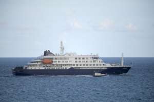 The hantavirus-stricken cruise ship MV Hondius leaves Tenerife on May 11, 2026.  By JORGE GUERRERO (AFP)