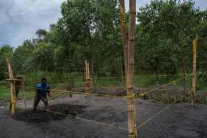 The makeshift wrestling ring is fashioned out of bamboo poles and thin yellow rope.  By Badru Katumba (AFP)