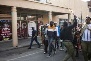 The march was peaceful although some participants carried sticks and others waved placards reading Go home.  By EMMANUEL CROSET (AFP)