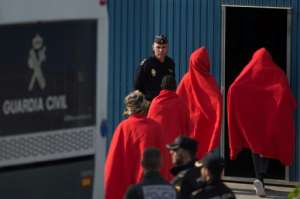 The migrants received clothes and food, as well as medical tests if required, from Red Cross officials.  By JORGE GUERRERO (AFP)