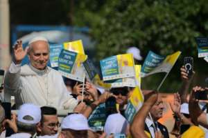The pope drew crowds as he arrived to celebrate mass.  By Tiziana FABI (AFP)