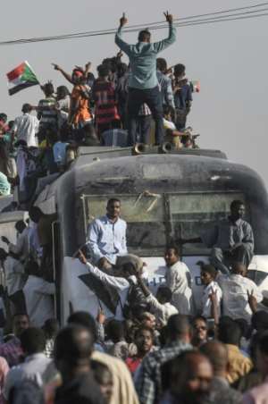 The protestors chanted freedom, peace, justice as crowds of supporters greeted them in Khartoum.  By OZAN KOSE (AFP)