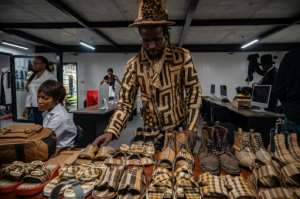 The Sape subculture traces it origins to the colonial era when locals encountered European fashion.  By Hardy BOPE (AFP)