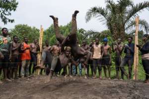 The soft ground wrestling is as much about theatre as sport.  By Badru Katumba (AFP)