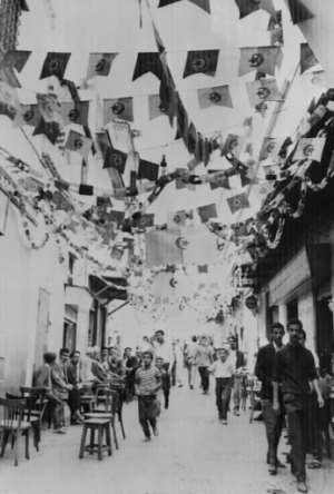 The streets of Algiers are decorated with National Liberation Front (FLN) and soon independent Algerian state flags on July 1, 1962.  By - (AFP)
